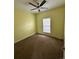 Cozy bedroom features a ceiling fan, carpeted floor, and a bright window at 7811 St Vrain Dr # 68, Frederick, CO 80530