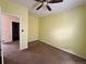 A bedroom featuring a ceiling fan and neutral walls with plush carpeting at 7811 St Vrain Dr # 68, Frederick, CO 80530