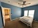 Spacious primary bedroom with ample natural light and a ceiling fan at 7811 St Vrain Dr # 68, Frederick, CO 80530