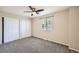 Spacious bedroom with carpet, a ceiling fan, and a large window with natural light at 9661 Autumnwood Pl, Highlands Ranch, CO 80129