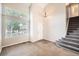 Bright foyer features tile flooring, a staircase to the upper level, and a large window at 9661 Autumnwood Pl, Highlands Ranch, CO 80129