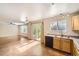 Eat-in kitchen and living space offering a convenient layout and natural light at 9661 Autumnwood Pl, Highlands Ranch, CO 80129
