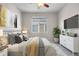 Well-lit bedroom featuring a comfortable bed, modern decor, and a large window for natural light at 540 E Fremont Pl, Centennial, CO 80122