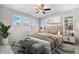 Cozy bedroom with ample natural light, neutral decor, and comfortable furnishings at 540 E Fremont Pl, Centennial, CO 80122