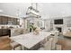 Open-concept dining area features a stylish table, chairs, and seamless flow to the living spaces at 540 E Fremont Pl, Centennial, CO 80122
