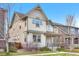 Well-kept two-story house with a covered porch and green lawn, offering a welcoming curb appeal at 540 E Fremont Pl, Centennial, CO 80122