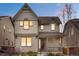 Charming two-story home with a welcoming front porch and a well-maintained lawn at 540 E Fremont Pl, Centennial, CO 80122