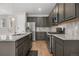 Spacious kitchen features stainless steel appliances, ample countertop space, and stylish backsplash at 540 E Fremont Pl, Centennial, CO 80122