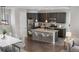 Well-designed kitchen with stainless steel appliances, granite countertops, and ample seating at the island at 540 E Fremont Pl, Centennial, CO 80122