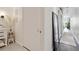 Bright hallway featuring modern decor, stylish mirror, and convenient closet space at 7240 W Custer Ave # 303, Lakewood, CO 80226