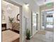 Hallway leading to the entry, featuring modern lighting and elegant decor at 7240 W Custer Ave # 303, Lakewood, CO 80226