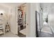 Hallway featuring access to a walk-in closet with custom shelving and an organized layout at 7240 W Custer Ave # 303, Lakewood, CO 80226