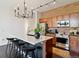 Modern kitchen with quartz countertops, stainless steel appliances, and black bar stools at 7240 W Custer Ave # 303, Lakewood, CO 80226