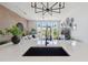 Quartz kitchen island with sink looks out over the living space and decor at 7240 W Custer Ave # 303, Lakewood, CO 80226
