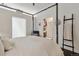 Bright main bedroom featuring a four-poster bed, walk-in closet, and cozy reading nook at 7240 W Custer Ave # 303, Lakewood, CO 80226