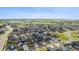 An aerial view of a new residential neighborhood backing to open space with a mountain view in the distance at 14423 Shasta Daisy Ln, Parker, CO 80134