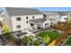An aerial view of the backyard with outdoor seating, a plunge pool, fire pit and patio, backing to open space at 14423 Shasta Daisy Ln, Parker, CO 80134