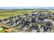 An aerial view of a new residential neighborhood backing to open space with a mountain view at 14423 Shasta Daisy Ln, Parker, CO 80134