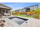 Backyard featuring a water feature, cozy outdoor fire pit, and relaxing lounge chairs at 14423 Shasta Daisy Ln, Parker, CO 80134