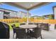 Backyard featuring a cozy outdoor fire pit, patio seating and a grill at 14423 Shasta Daisy Ln, Parker, CO 80134