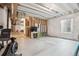 Unfinished basement with rough-in plumbing, exposed beams, and lots of natural light from the window at 14423 Shasta Daisy Ln, Parker, CO 80134