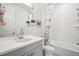 A stylish bathroom featuring white subway tile in shower and modern fixtures at 14423 Shasta Daisy Ln, Parker, CO 80134