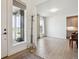 Welcoming entryway featuring hardwood floors and modern decor with lots of natural light at 14423 Shasta Daisy Ln, Parker, CO 80134