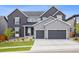 Beautiful two-story home with well-manicured lawn and a two-car attached garage at 14423 Shasta Daisy Ln, Parker, CO 80134