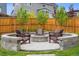 Backyard featuring a cozy outdoor fire pit with outdoor seating at 14423 Shasta Daisy Ln, Parker, CO 80134