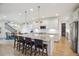 Expansive kitchen island with bar seating, perfect for entertaining, with an open floor plan at 14423 Shasta Daisy Ln, Parker, CO 80134
