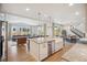 Open-concept kitchen with island, stainless steel appliances, and views of the living and dining areas at 14423 Shasta Daisy Ln, Parker, CO 80134