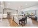 Open-concept kitchen with stainless steel appliances and center island at 14423 Shasta Daisy Ln, Parker, CO 80134