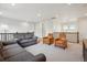 Upstairs living room featuring neutral couches, chairs, and an overlooking view to the entry way at 14423 Shasta Daisy Ln, Parker, CO 80134