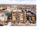 An aerial view shows the building's architecture and its location within the neighborhood at 1925 W 32Nd Ave # 404, Denver, CO 80211