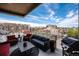 Balcony features an outdoor grill, comfortable seating, and unobstructed city views at 1925 W 32Nd Ave # 404, Denver, CO 80211