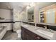 Bathroom with double vanity, walk-in shower, and modern fixtures at 1925 W 32Nd Ave # 404, Denver, CO 80211