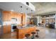 Island kitchen with stainless steel appliances, a gray countertop, and bar stool seating at 1925 W 32Nd Ave # 404, Denver, CO 80211
