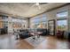 Living room area filled with natural light, hardwood flooring, and views of the cityscape at 1925 W 32Nd Ave # 404, Denver, CO 80211