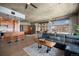 Bright open concept area with an island kitchen, a comfortable seating area, and plenty of natural light at 1925 W 32Nd Ave # 404, Denver, CO 80211