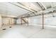 Unfinished basement featuring support beams, concrete floor, and plastic-covered walls at 4323 Soapberry Pl, Castle Rock, CO 80108