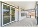 Beautiful covered deck with sliding glass doors and outdoor lighting fixtures at 4323 Soapberry Pl, Castle Rock, CO 80108