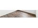 Close-up showcases beautiful wood-look flooring in a residence at 4323 Soapberry Pl, Castle Rock, CO 80108