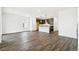 Open-concept living area featuring wood-look flooring and modern kitchen at 4323 Soapberry Pl, Castle Rock, CO 80108