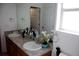 Bathroom features double sinks and vanity, enhanced by natural light at 2848 Merry Rest Way, Castle Rock, CO 80109