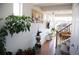 Hallway with plants, hardwood floors, stairs, and wall art, offering a cozy and inviting atmosphere at 2848 Merry Rest Way, Castle Rock, CO 80109