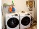 Laundry room featuring new, modern, front-loading washer and dryer at 2848 Merry Rest Way, Castle Rock, CO 80109