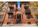 Brick apartment building featuring secure entry, balconies, and ornate details at 1475 N Humboldt St # 20, Denver, CO 80218
