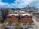 A stunning, vibrant daytime shot of a brick apartment building with a cityscape view including mountains and blue sky at 1475 N Humboldt St # 20, Denver, CO 80218