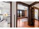 Open living room with exposed brick wall, hardwood floors, and natural light at 1475 N Humboldt St # 20, Denver, CO 80218