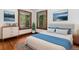 Serene bedroom featuring hardwood floors, natural light, and comfortable furnishings at 4010 Grove St, Denver, CO 80211